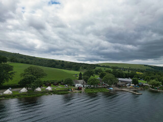 Obraz premium Aerial View of Lake Districts Valley and Mountains of UK. Drone Camera View Was Captured From Medium High Altitude During Mostly Dramatic Cloudy Day of Summer 2026