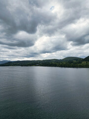 Fototapeta premium Aerial View of Lake Districts Valley and Mountains of UK. Drone Camera View Was Captured From Medium High Altitude During Mostly Dramatic Cloudy Day of Summer 2026