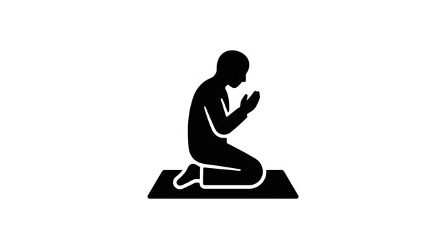 Man praying on a mat in silence.