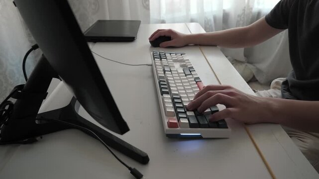 An active and diligent gamer. A passionate gamer, immersed in gaming in a clean workspace. A teenager focused on gaming at a well-organized and brightly lit workstation
