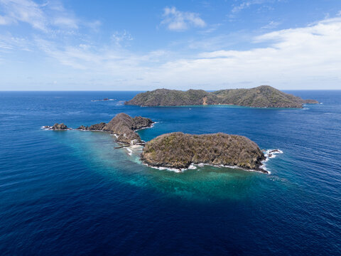 Drone Shot of Isolated Rocky Island in Blue Sea Tobago