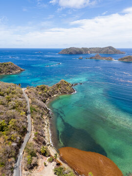 Drone View of Coastal Road and Rocky Headland Tobago