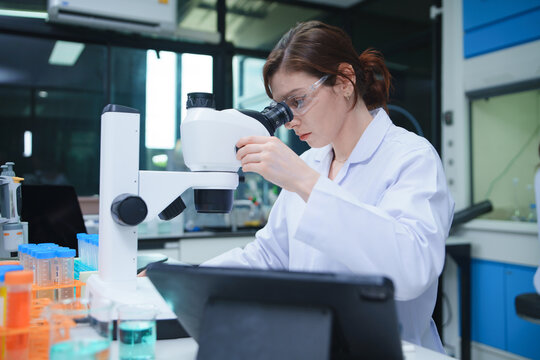 Scientist Performing Microscopy Analysis in Advanced Laboratory