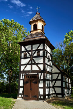 Historic parish church with a half-timbered structure in the village of Swięty Wojciech
