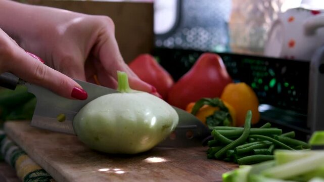 Warm sunlight highlights a cozy homemade vegan cooking process with natural seasonal vegetables from the garden. 