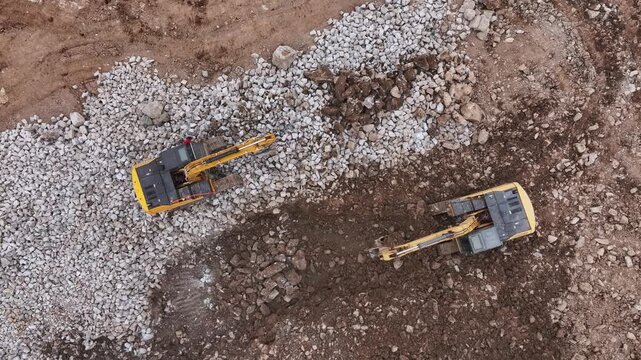Two excavators working at a construction site