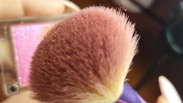 Macro Makeup Brush Over Pink Shimmer Compact
