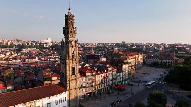 Aerial Orbit of Torre dos Clerigos at sunset in Porto, Portugal