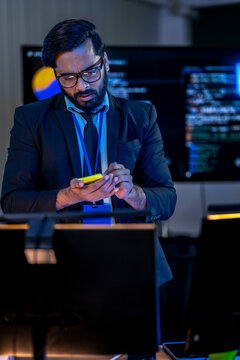 AI specialist utilizing a tablet to perform real time code validation and system architecture adjustments in a tech focused environment.