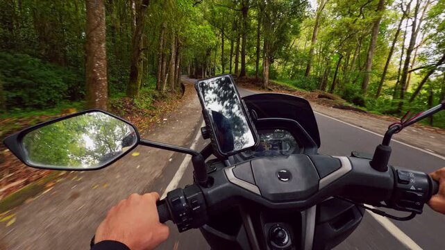 First Person Scooter Ride Through Tight Forest Curve Along Scenic Tropical Road Surrounded by Tall Trees