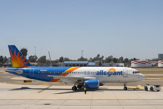 Santa Ana, CA, USA - May 6, 2022: An Airbus A320-214 aircraft operated by the ultra-low-cost carrier Allegiant Air is seen on the tarmac at John Wayne Airport in Santa Ana, California.