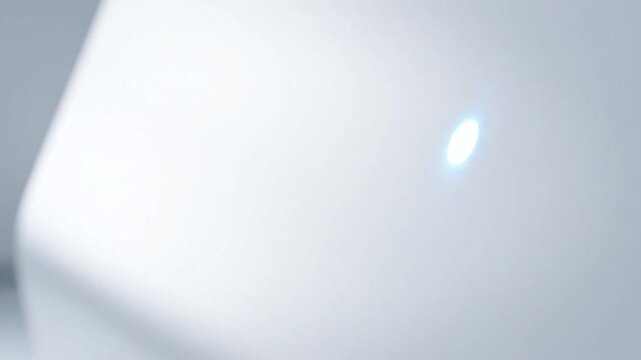 Hand tapping RFID keycard on white smart reader to unlock access.