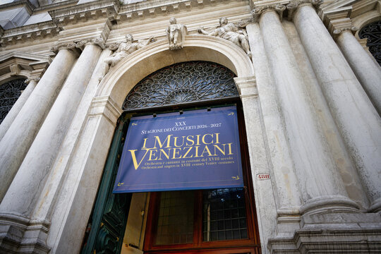 Venice, Italy June 03 2026: A blue event banner announcing the concert season of "I Musici Veneziani" at the baroque entrance of Scuola Grande di San Teodoro in Venice.