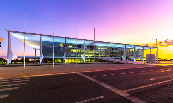 BRASILIA, BRAZIL - MAY 5, 2026: The Palacio do Planalto building, official workplace of the President of Brazil, designed by Oscar Niemeyer at twilight with purple and orange sunset sky