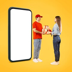 Obraz premium Happy Man And Woman Exchanging Gifts In Front Of Smartphone Display At Celebratory Setting, Smiling Together In Joyful Moment On Bright Yellow Background. Celebration Concept.
