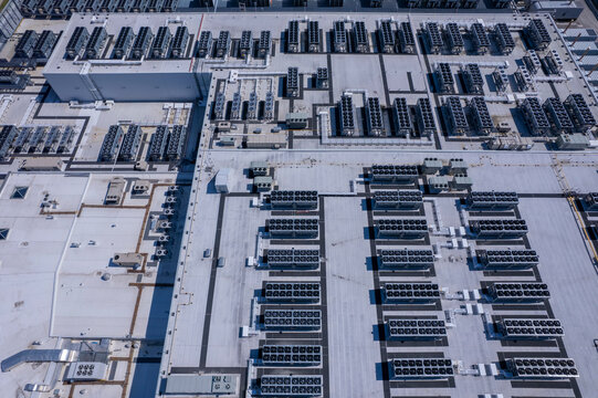 Aerial view of data center with ventilators, advanced technology cooling systems, HVAC at data center rooftop, cooling infrastructure for server operations