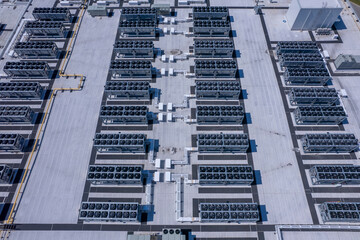 Naklejka premium Aerial view of Hyperscale Datacenter, AI data center cooling systems, piping electrical equipment. Chilling equipment and electrical substations generators