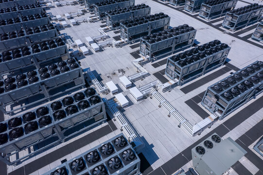 Aerial view of Hyperscale Datacenter, AI data center cooling systems, piping electrical equipment. Chilling equipment and electrical substations generators