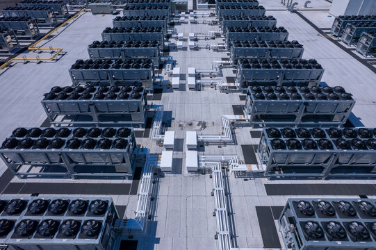 Aerial view of data center with ventilators, advanced technology cooling systems, HVAC at data center rooftop, cooling infrastructure for server operations