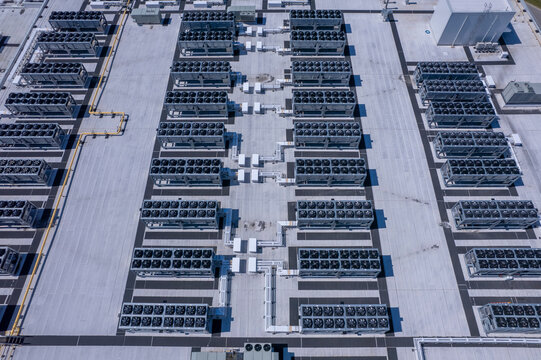 Aerial view of Hyperscale Datacenter, AI data center cooling systems, piping electrical equipment. Chilling equipment and electrical substations generators