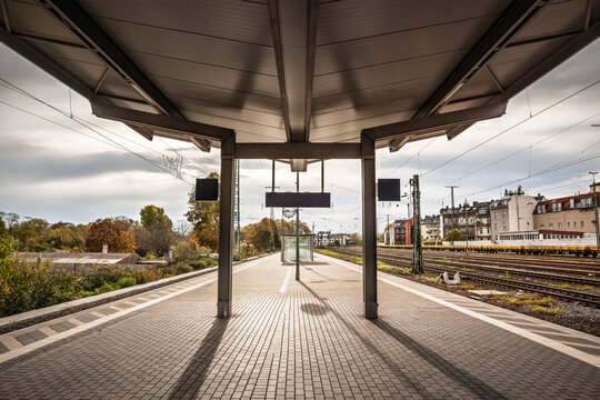 Platform at Koln Westbahnhof in the Neustadt district, showing railway tracks, a quiet urban train station setting. Koln Westbhf is Cologne west train station, in the suburb of Neustadt in germany.