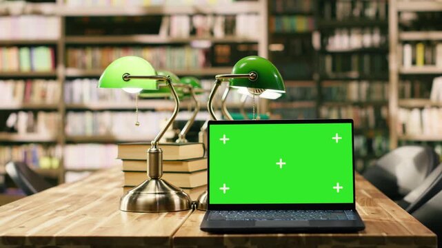 Isolated green screen mockup on laptop inside empty library, copy space of replaceable screen device.
