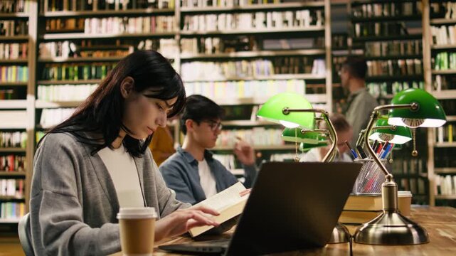 Young adult drinking coffee and taking notes on laptop from open book, focused student using study materials for exam preparation, Independent study with drink, with study session and coursework.