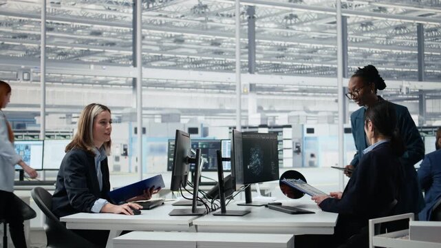 Analyzing chip architecture, AI model and senior manager in microchip factory laboratory.