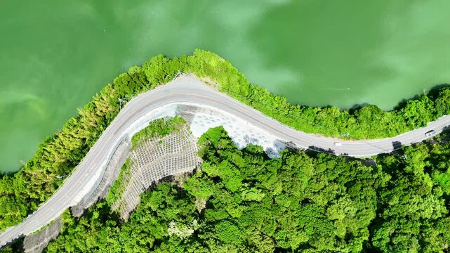 Aerial view of road in the side of lake and green mountain in Japan, beautiful landscape