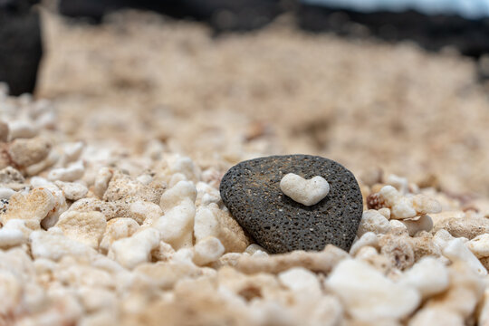 Heart-Shaped Rock Among Pebbles