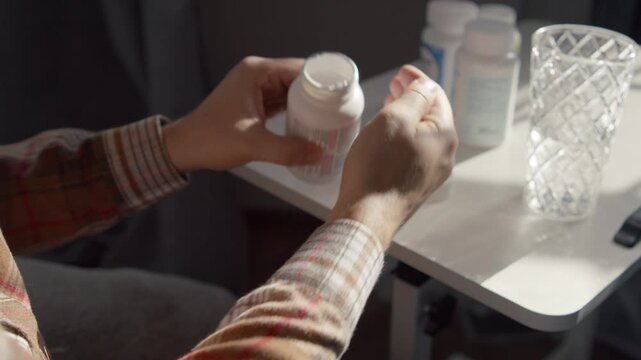 Close Up Man Hands Holding Pills And Drinking Water At Home Health Recovery Concept Medicine Intake Flu Treatment Headache Relief Prevention Lifestyle Scene Perfect For Healthcare Advertising