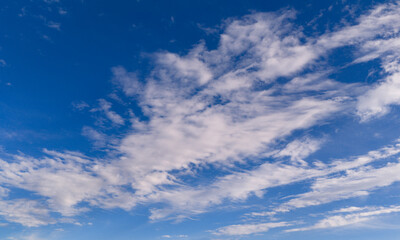 Naklejka premium Clouds sky background blue texture. Bright soft clouds white pattern. Daytime clouds wallpaper backdrop. Clouds cloudscape skyscape.