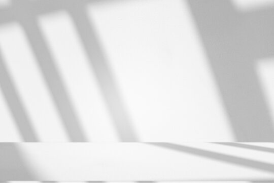 Wall interior background, studio and backdrops show products.with shadow from window color white and grey. background for text insertion and presentation product	