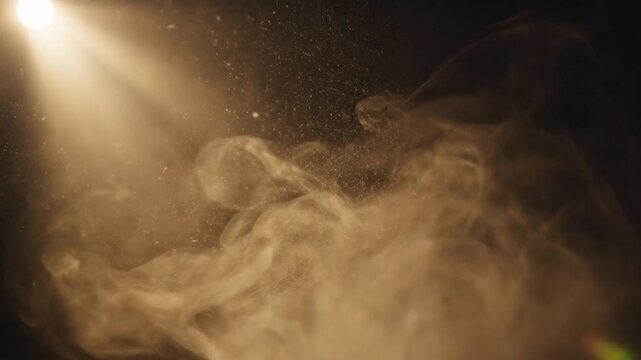Dramatic sunbeam illuminating floating dust motes in dark room.