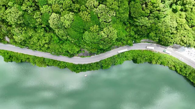 Aerial 4K drone view of river valley and road in Japan, beautiful landscape