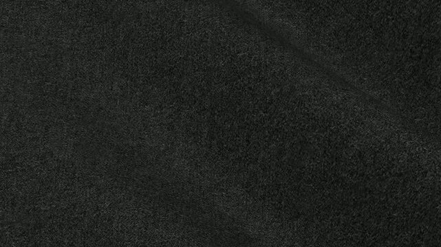 Charcoal Gray Italian Flannel Fabric rolling in soft ash colored waves of premium brushed wool texture for elegant executive winter suit style