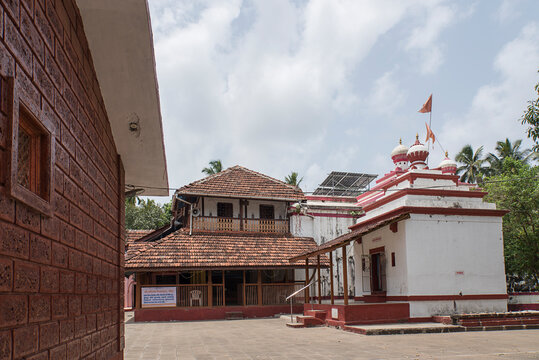 Shri Rameshwar temple or mandir, ancient temple of Lord Shiva, surrounded by coconut palm trees. In front of the temple there is a Pushkarini (stepped well). Chaul, Alibag, Raigad, Maharashtra, India.