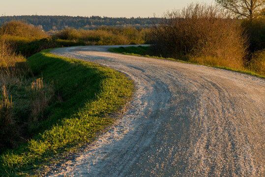 Canada, BC, Delta.  Hiking and biking trail along the dyke in Boundary Bay Regional Park.