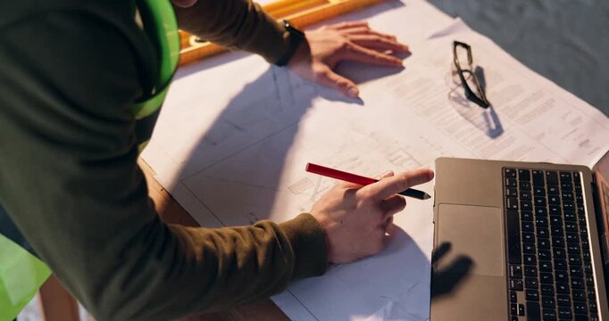 Person, hands or architect with blueprint or laptop on construction site for building or planning. Top view, civil engineer or contractor writing with floor layout or computer for architecture design