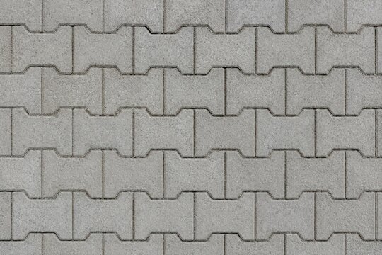 Gray interlocking concrete pavers pattern for sidewalk or driveway