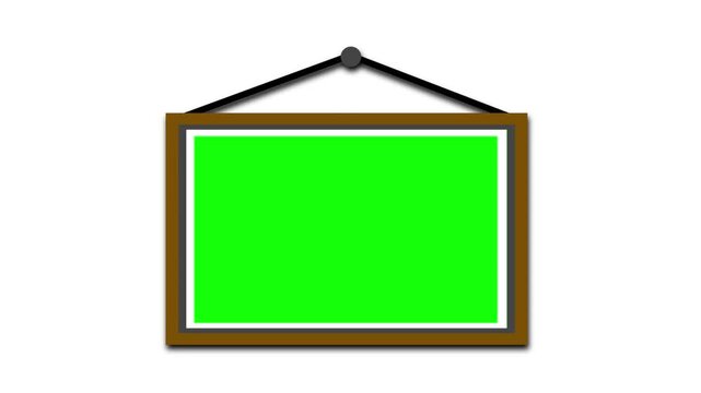 A wooden picture frame with a green screen chroma key area swings gently while hanging on a white background.