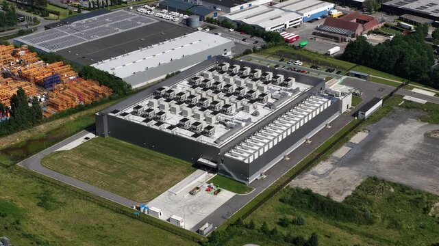 Aerial drone view of a data center supporting big data, machine learning, AI infrastructure, cloud computing and digital storage.