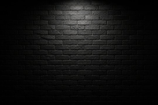 Dark black brick wall texture background with spotlight illumination
