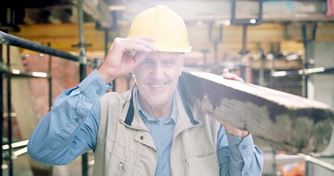 Construction, face or man on site with plank, positive attitude or pride as industrial worker. Happy, mature person or engineer with wood material, about us and confidence in architecture industry.