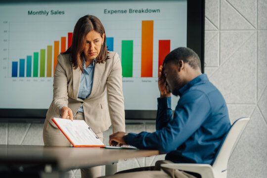 Boss scolding employee about poor sales performance