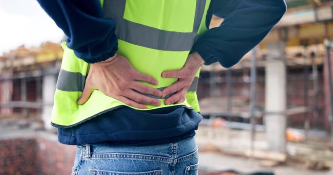 Construction, back pain or hands on site with massage, joint sprain or labor injury in building project. Accident, man or engineer with backache, spine issue or arthritis in industrial development.