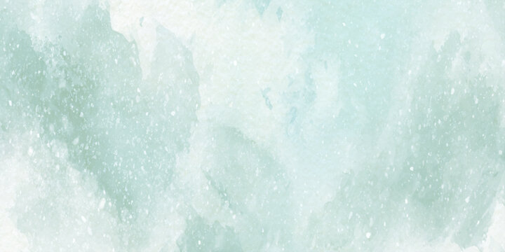Soft mint green watercolor background with white specks and subtle texture for design and artistic projects