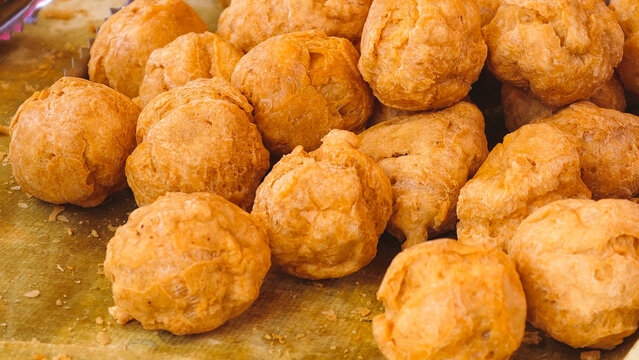 Delicious Golden Brown Fried Meatballs and Crunchy Vegetable Snacks Served as Appetizers.