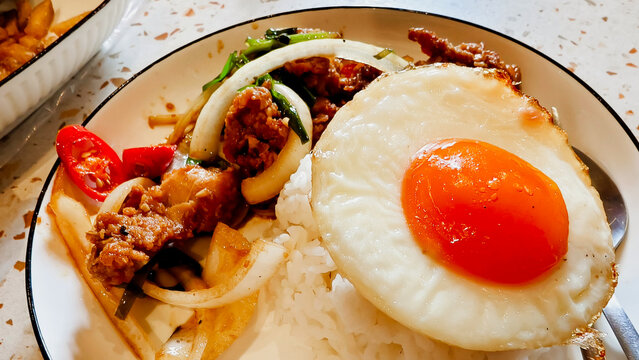 Thai Style Stir Fried Pork with Sunny Side Up Fried Egg and Rice