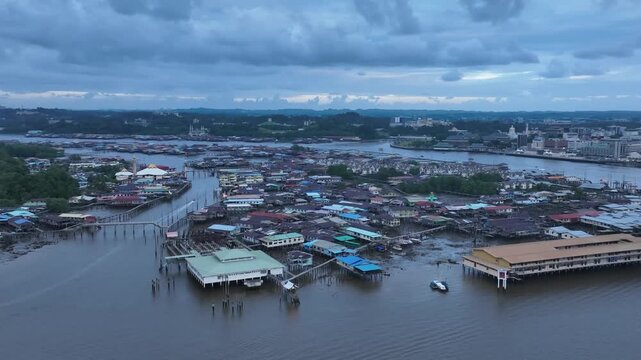 Aerial drone view of Kampong Ayer water village stilt houses on Brunei River at blue hour, Bandar Seri Begawan, Brunei, 1 February 2026